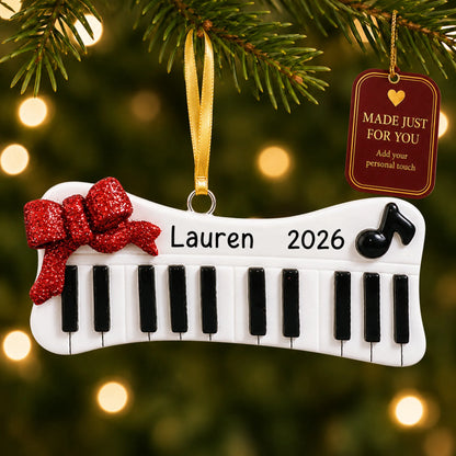 Keyboard christmas ornament hanging on a lit Christmas tree with a Made Just For You gift tag