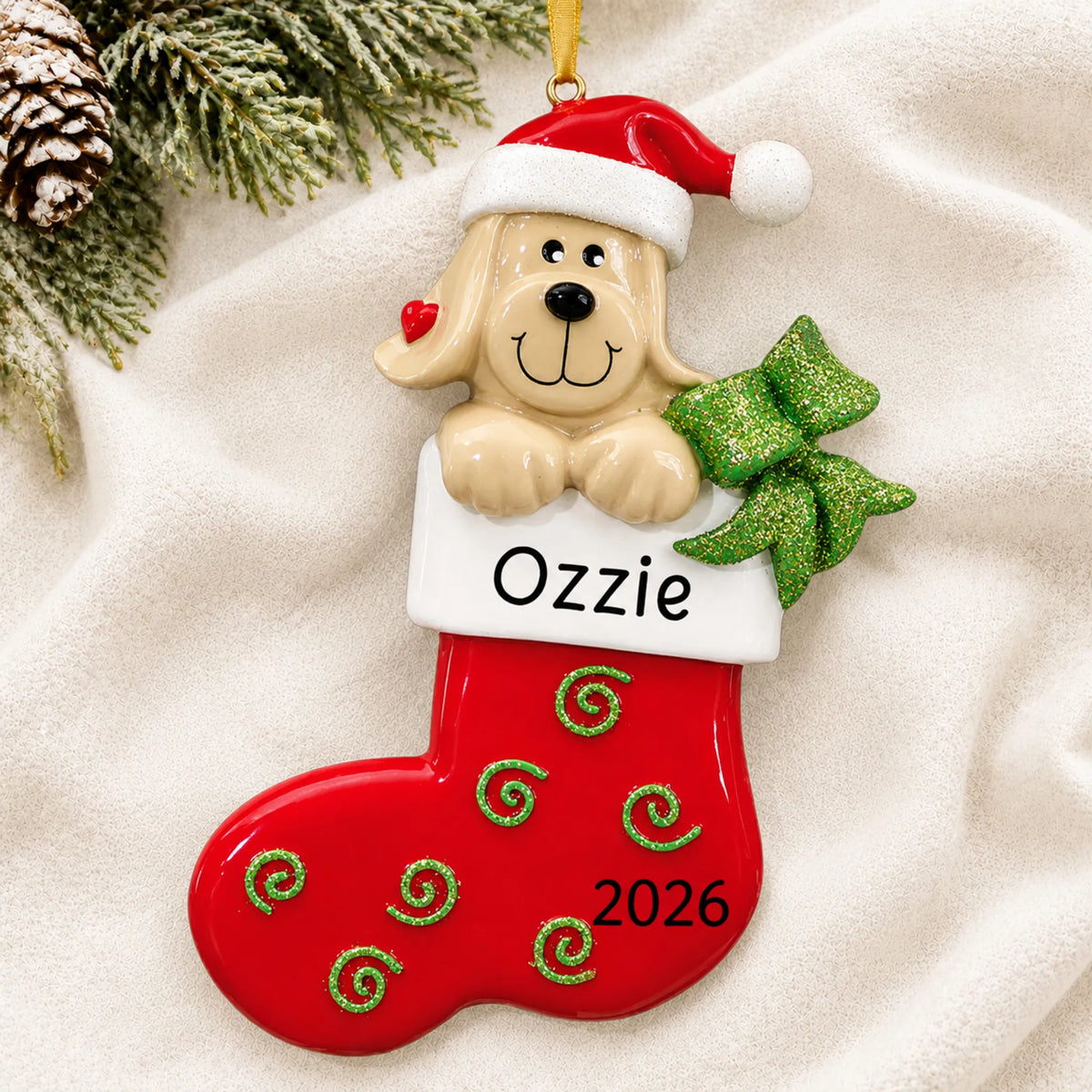 Personalized Dog In Stocking christmas ornament laid on a soft white knit blanket