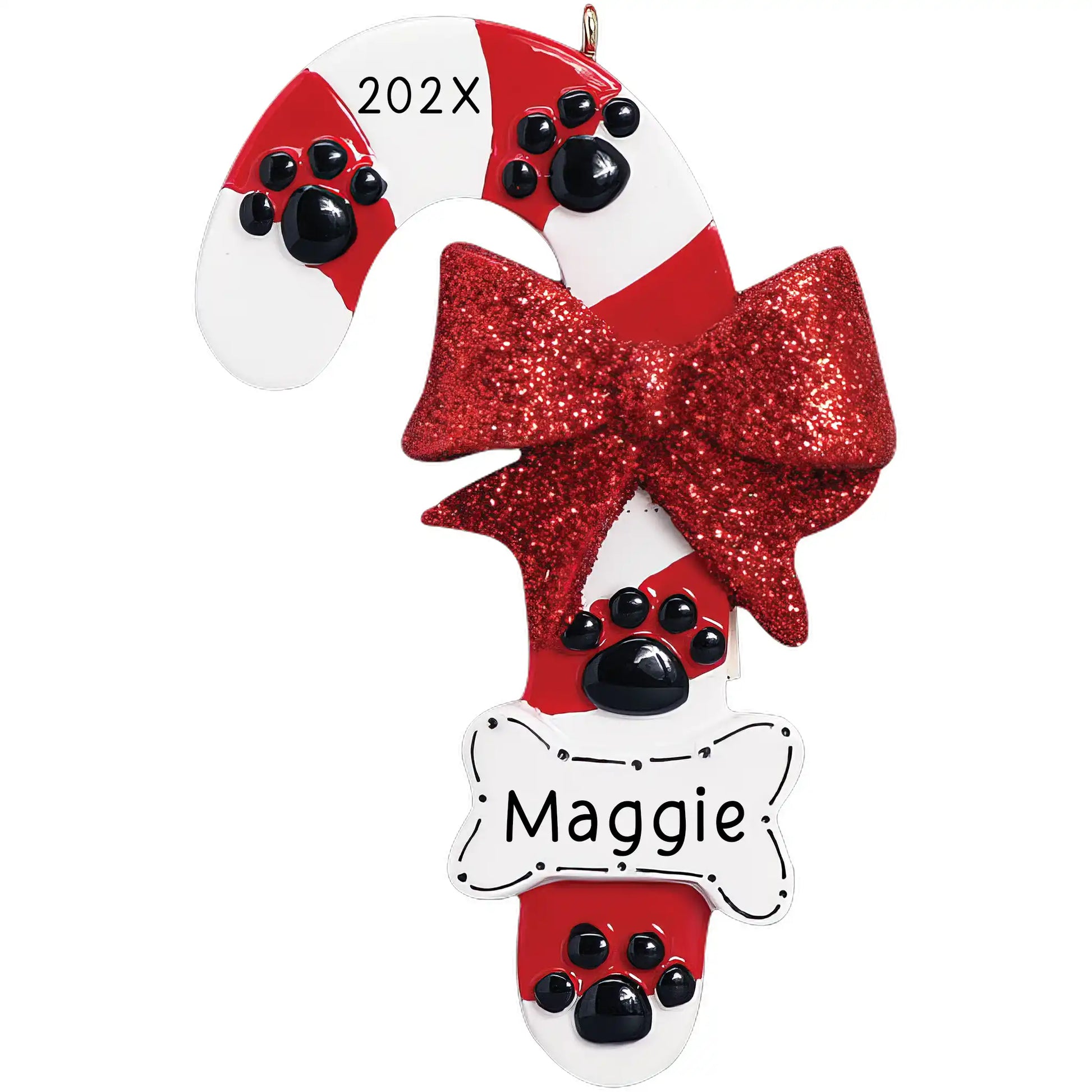 A personalized Christmas ornament in the shape of a candy cane, with a red and white color scheme, adorned with paw prints and a bow, and featuring a white bone at the bottom for personalization.