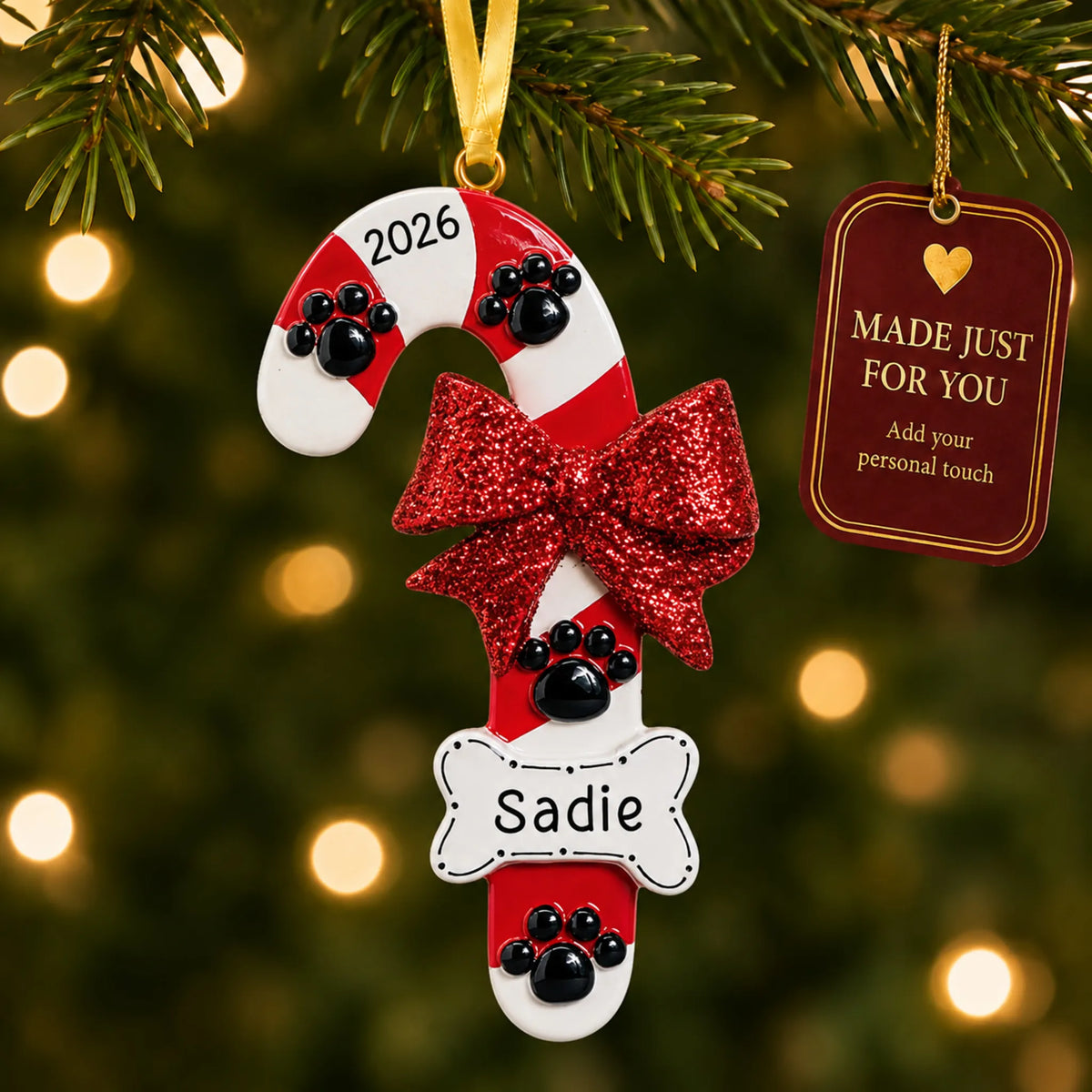 Dog Candy Cane christmas ornament hanging on a lit Christmas tree with a Made Just For You gift tag