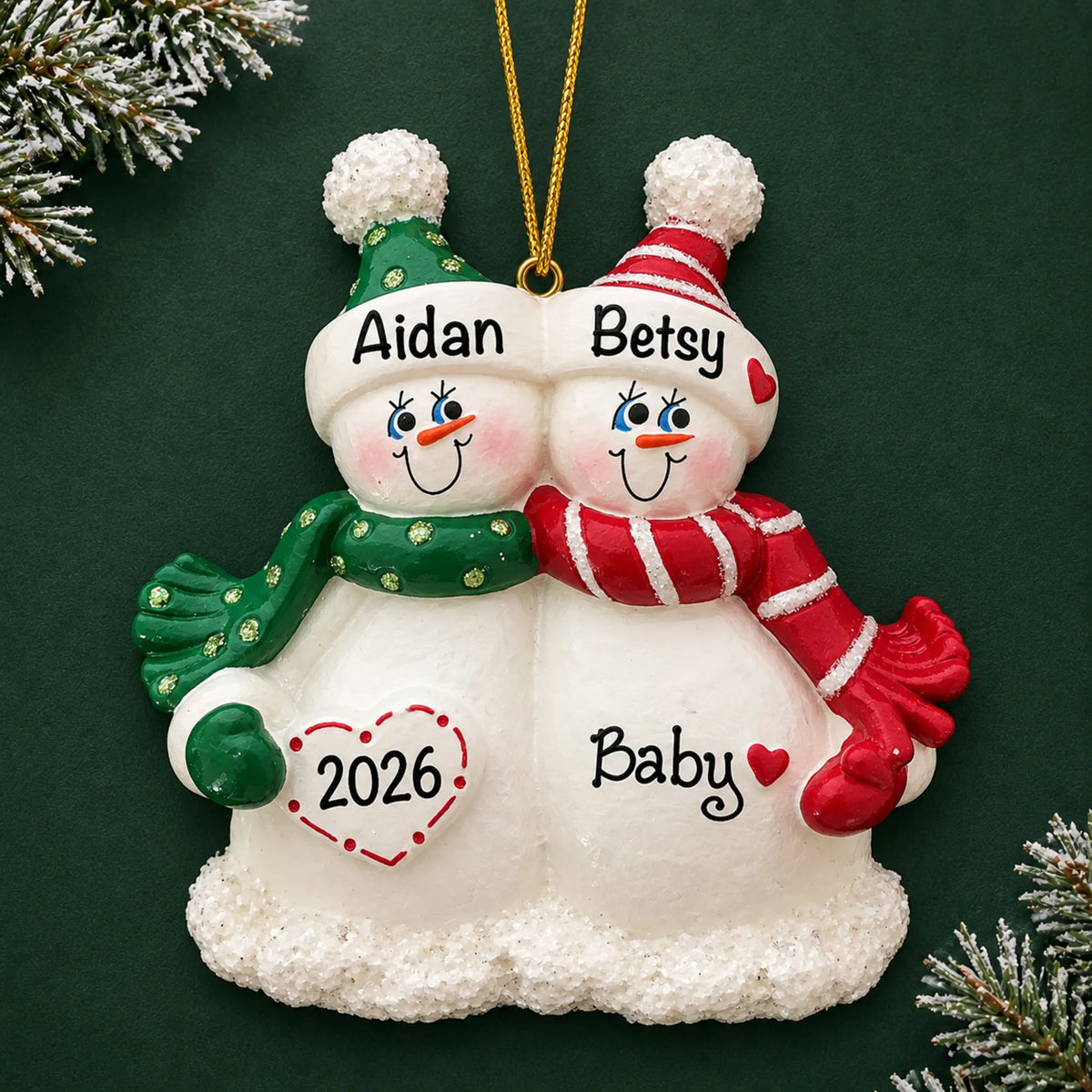 Personalized Snow Couple Expecting christmas ornament on a dark green pine background