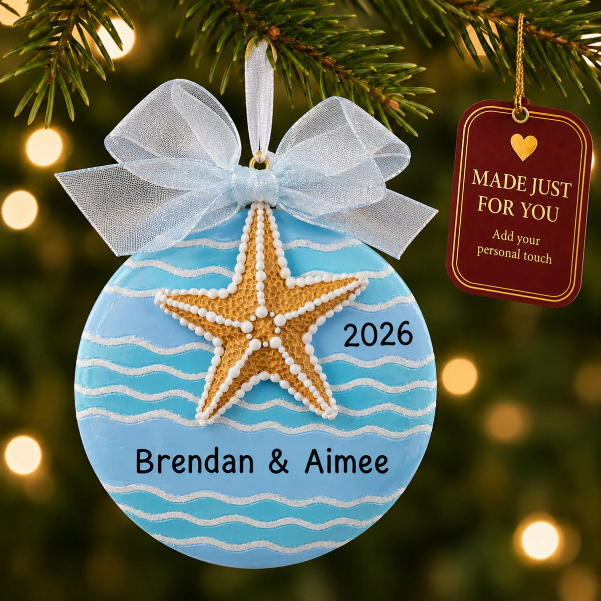 Starfish beach christmas ornament hanging on a lit Christmas tree with a Made Just For You gift tag