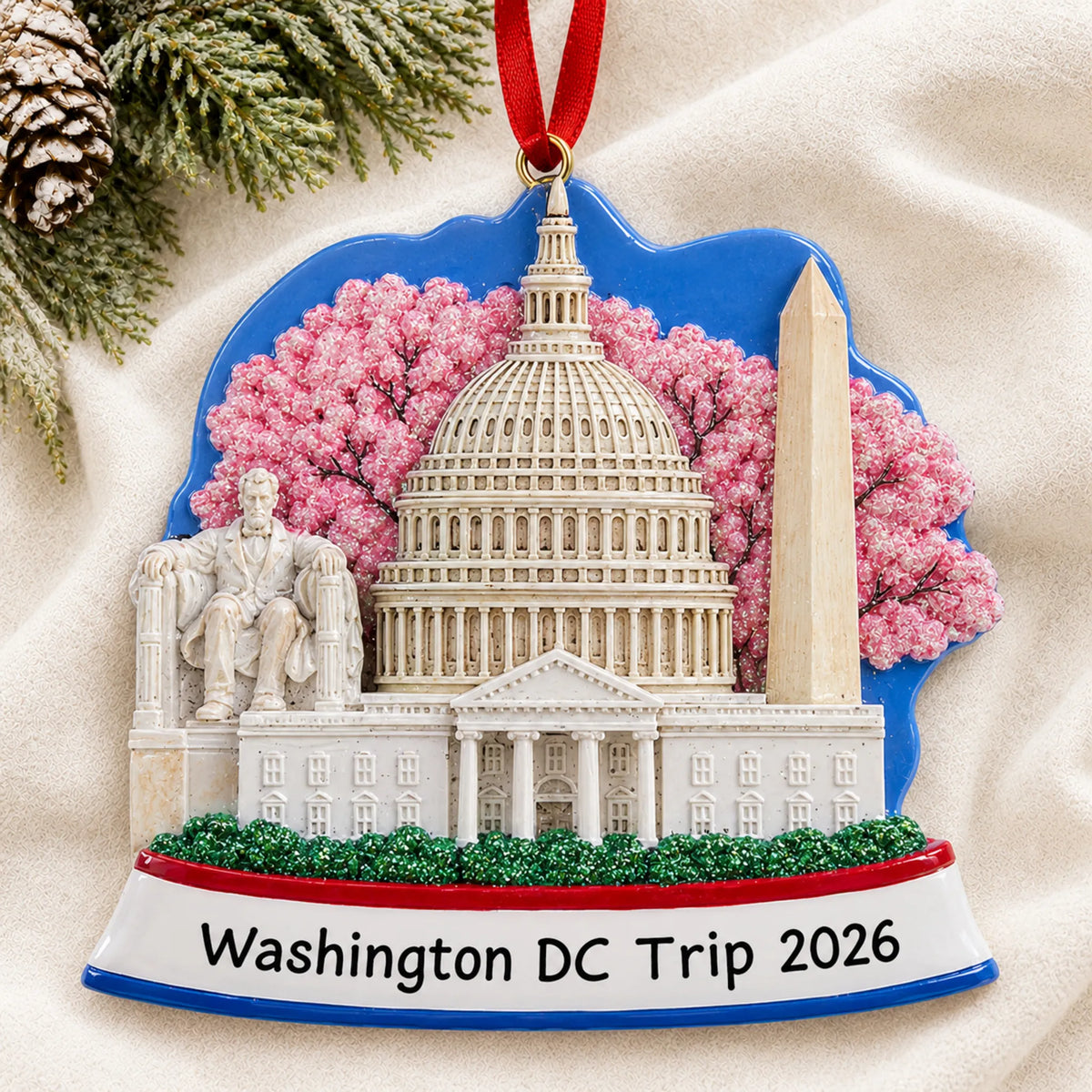 Personalized Washington DC christmas ornament laid on a soft white knit blanket