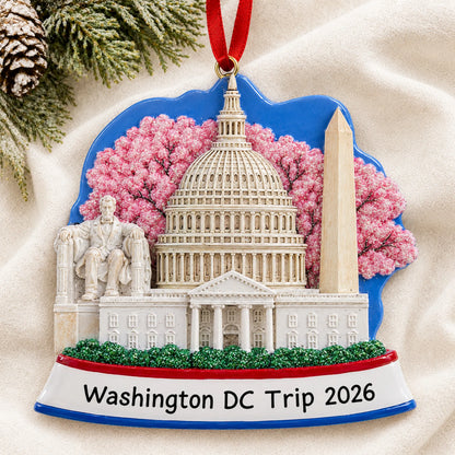 Personalized Washington DC christmas ornament laid on a soft white knit blanket