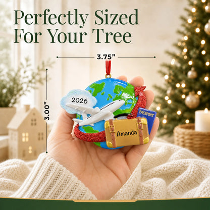 Size guide: the personalized travel christmas ornament is 3.75 in wide by 3.00 in tall, shown in hand