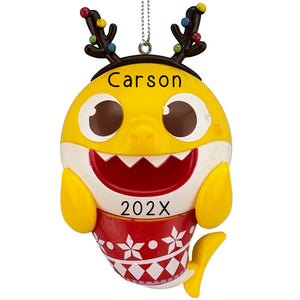 Yellow baby shark ornament wearing reindeer antlers with Christmas lights and personalized name