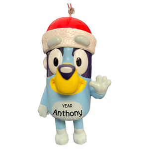 A personalized Christmas ornament of the animated character Bluey wearing a Santa hat, with a customizable name and year printed on it.