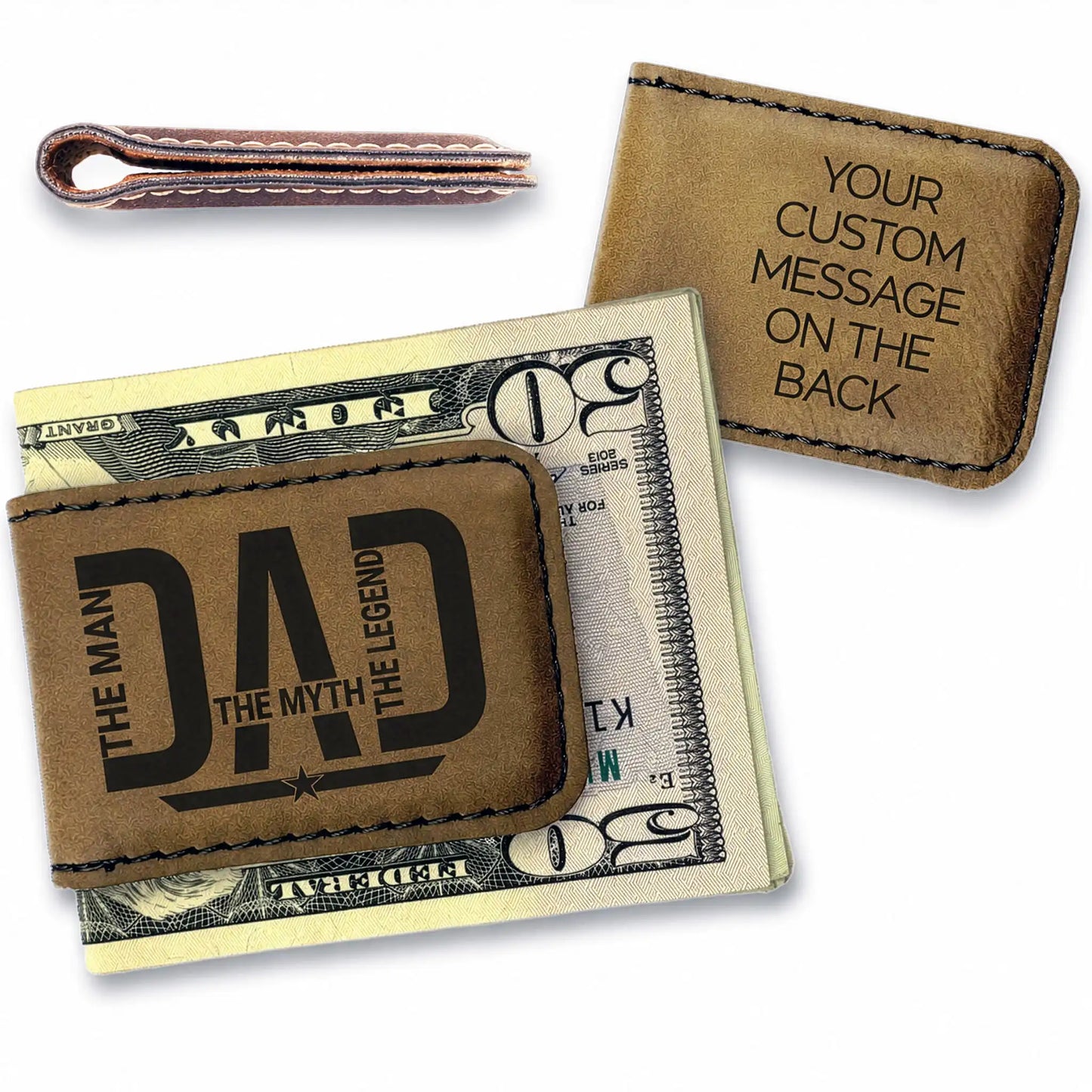 Brown leather money clip with 'DAD' engraving on a dollar bill, with another similar product in the background.