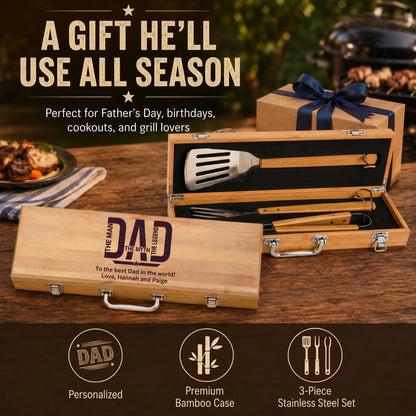 Barbecue tool set in a wooden case with personalized message, on a table with food in the background.