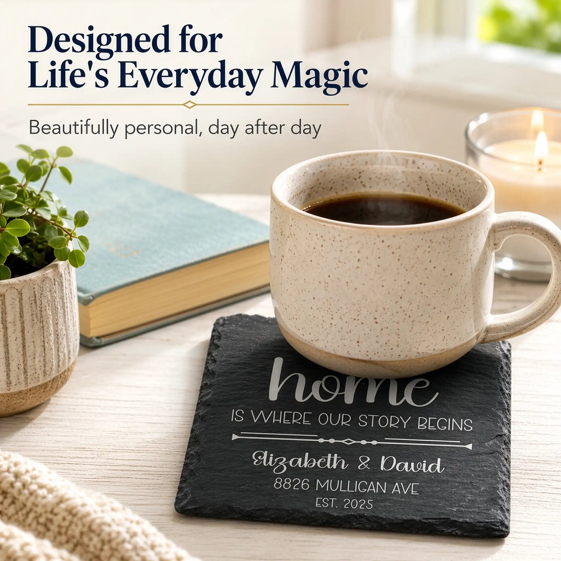 Ceramic mug with coffee on a slate coaster with personalized text, surrounded by a plant, book, and candle.