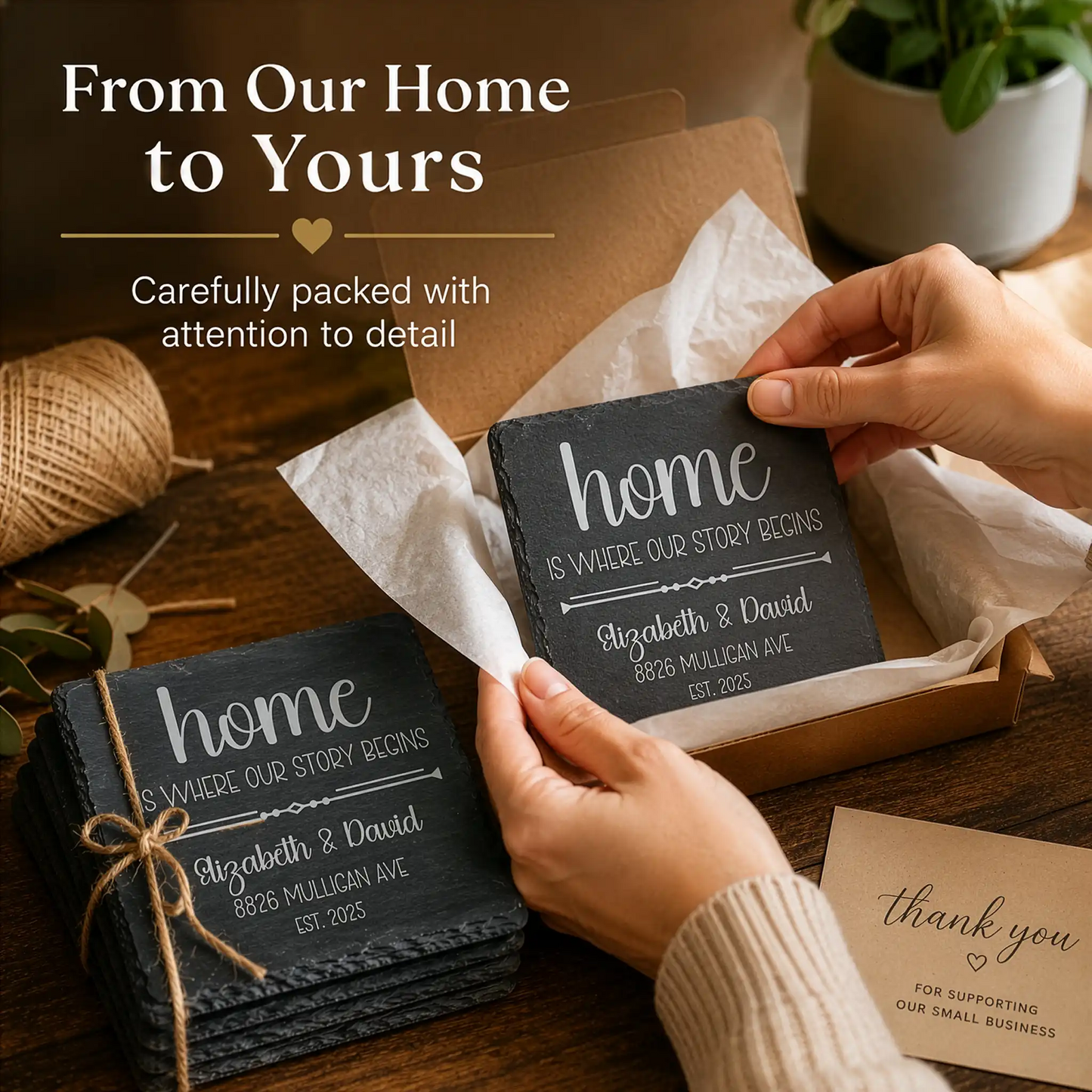 Person holding a personalized 'home' sign with packaging and a 'thank you' card on a wooden surface.