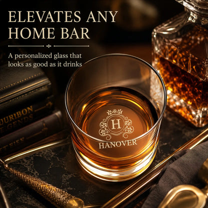 Personalized whiskey rocks glass styled on a home bar tray with crystal decanter and leather books