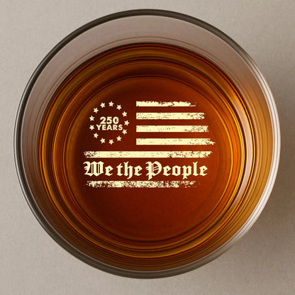 Personalized whiskey glass with custom name displayed alongside other patriotic and gift drinkware