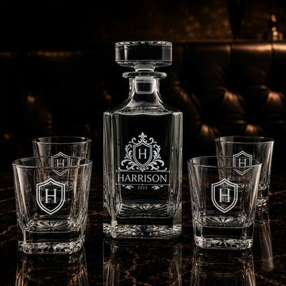 Personalized whiskey decanter set with engraved crest, custom name, initial, year, and four matching rocks glasses