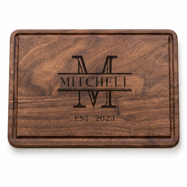 Wooden cutting board with engraved 'Mitchell' and 'EST. 2023' on a white background