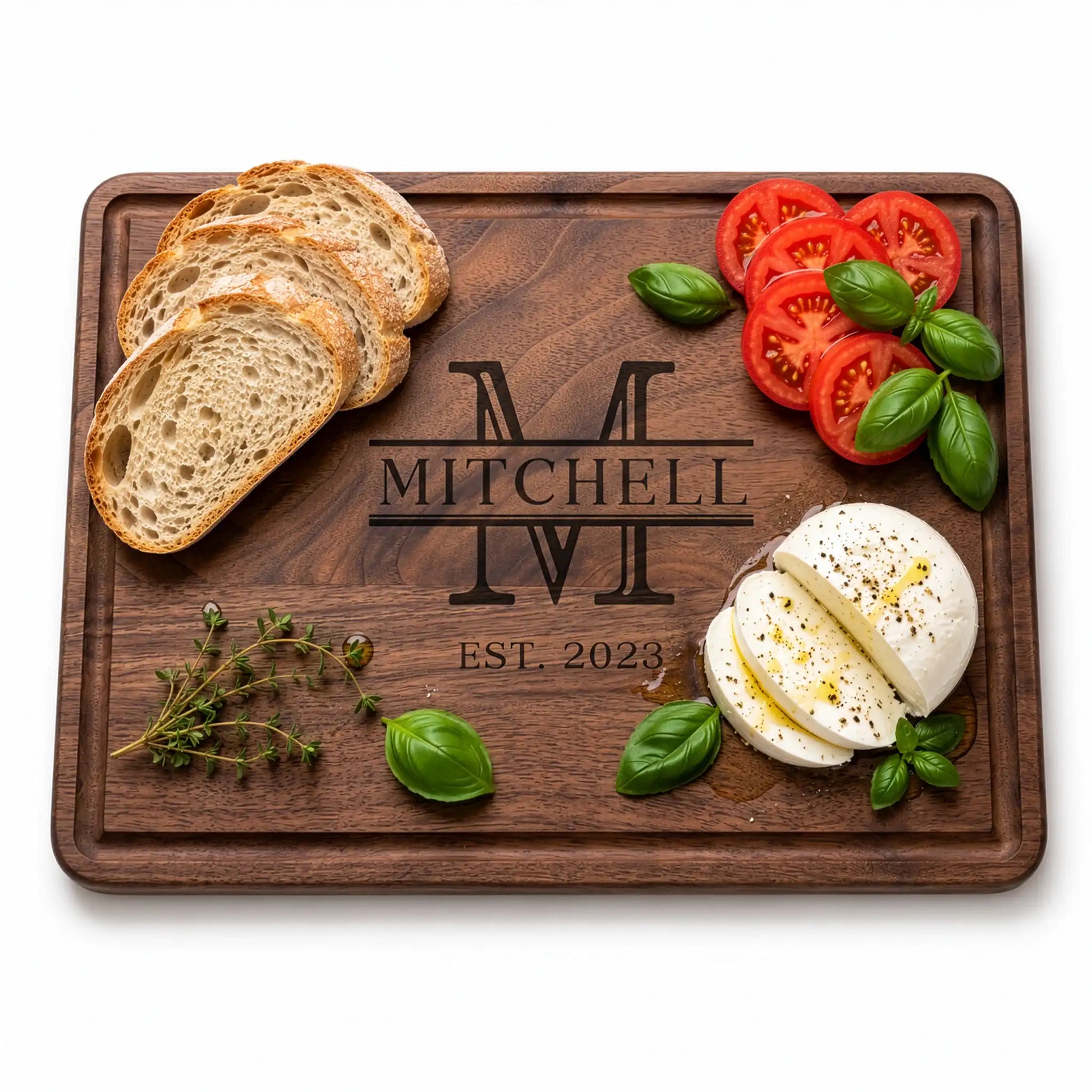 Wooden cutting board with bread, tomatoes, mozzarella, and herbs on a white background