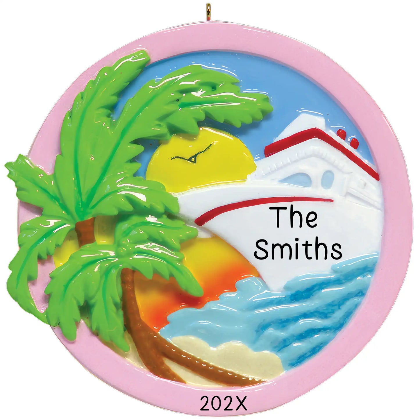 Personalized Christmas ornament depicting a white cruise ship sailing past a palm tree on a beach with a yellow sun, ready for custom engraving.