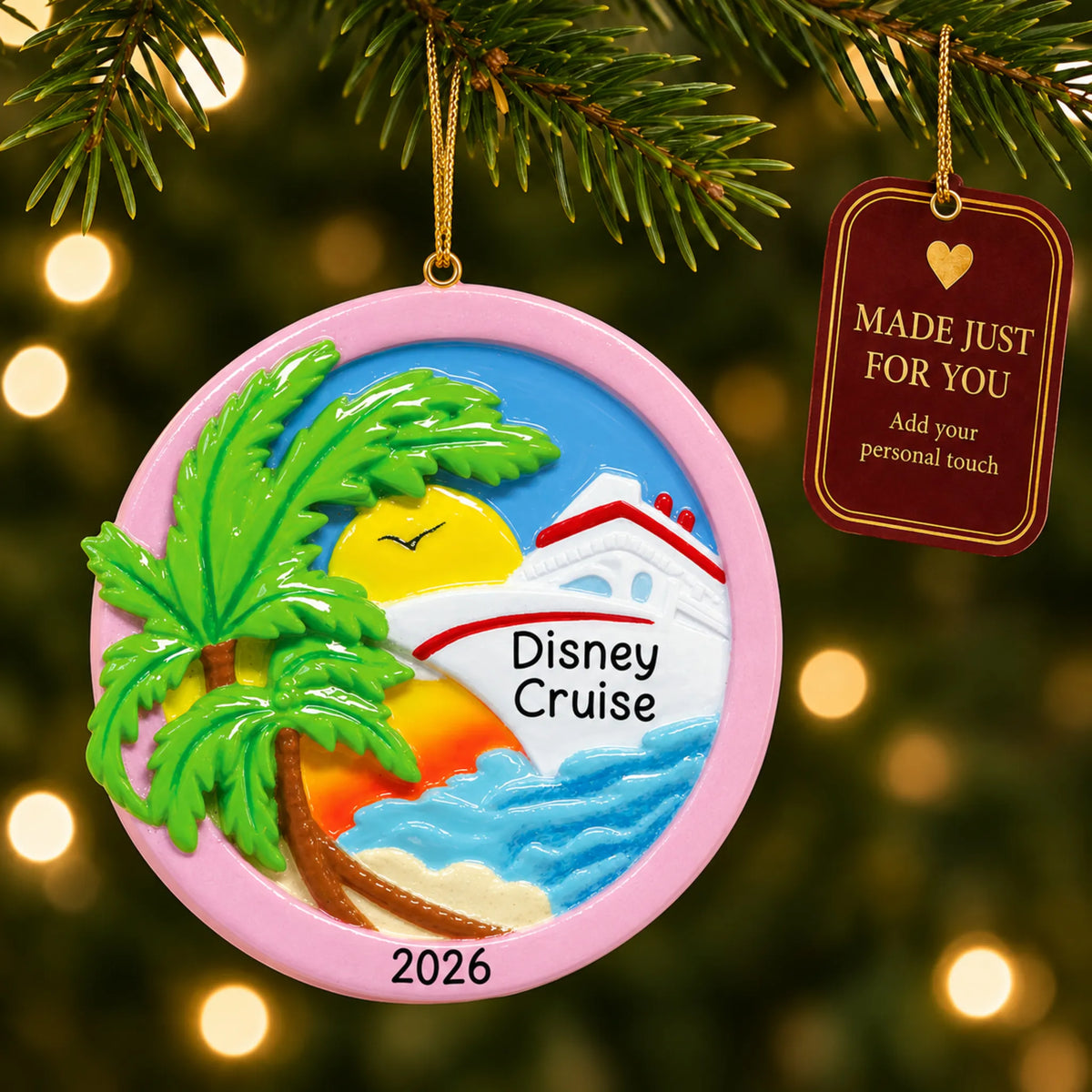 Tropical cruise ship christmas ornament hanging on a lit Christmas tree with a Made Just For You gift tag