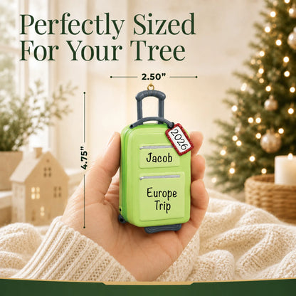 Size guide: the personalized green travel suitcase christmas ornament is 2.50 in wide by 4.75 in tall, shown in hand