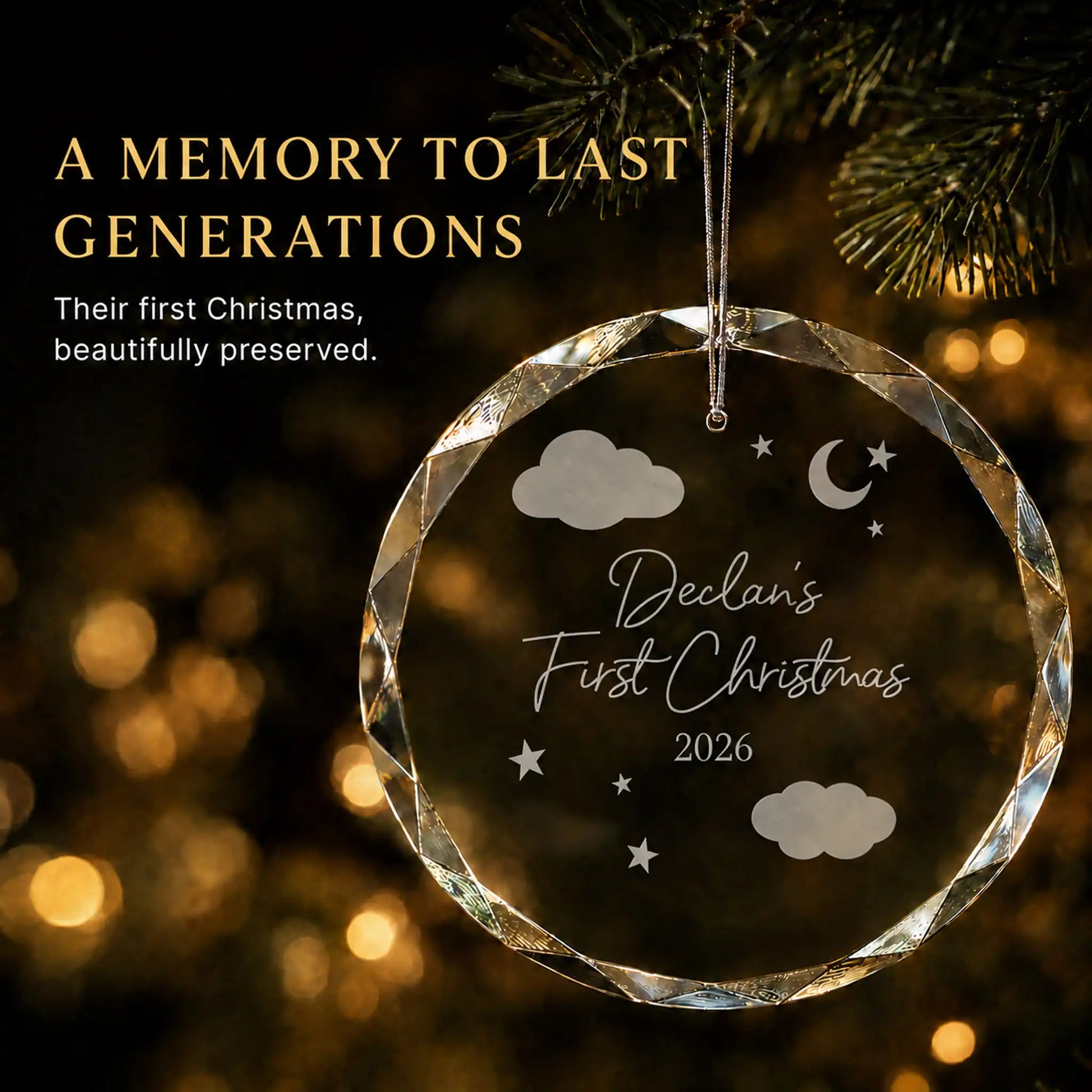 Personalized baby's first Christmas ornament in K9 optical glass hanging on a lit tree, engraved with a night sky design, baby's name and year