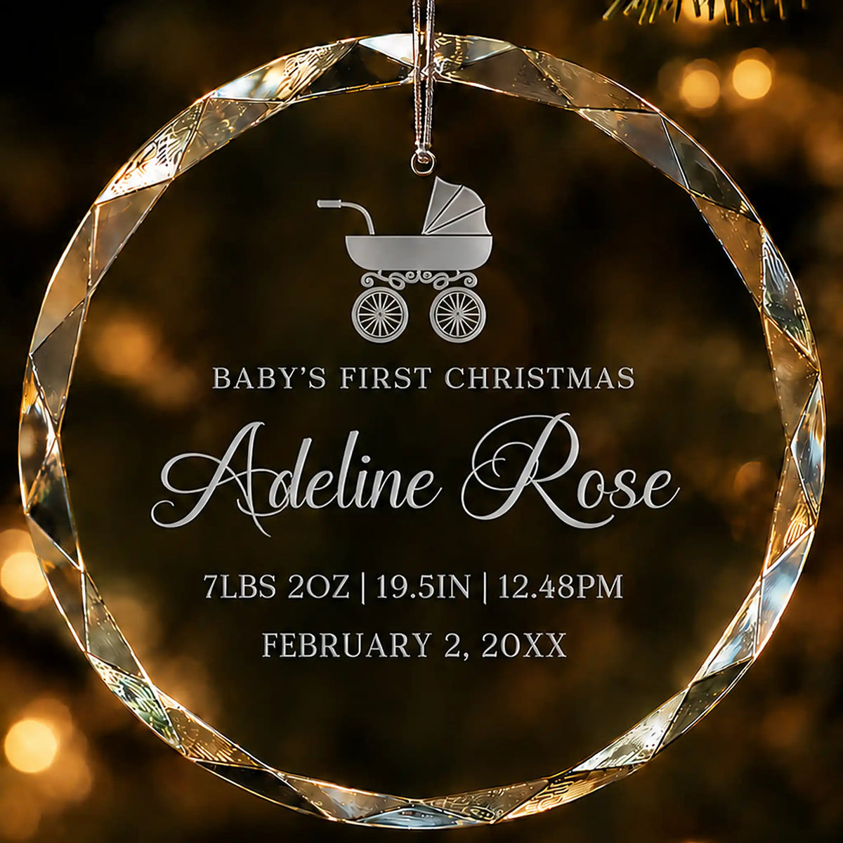 Baby's first Christmas glass ornament with a baby carriage design, laser engraved with baby's name and birth details