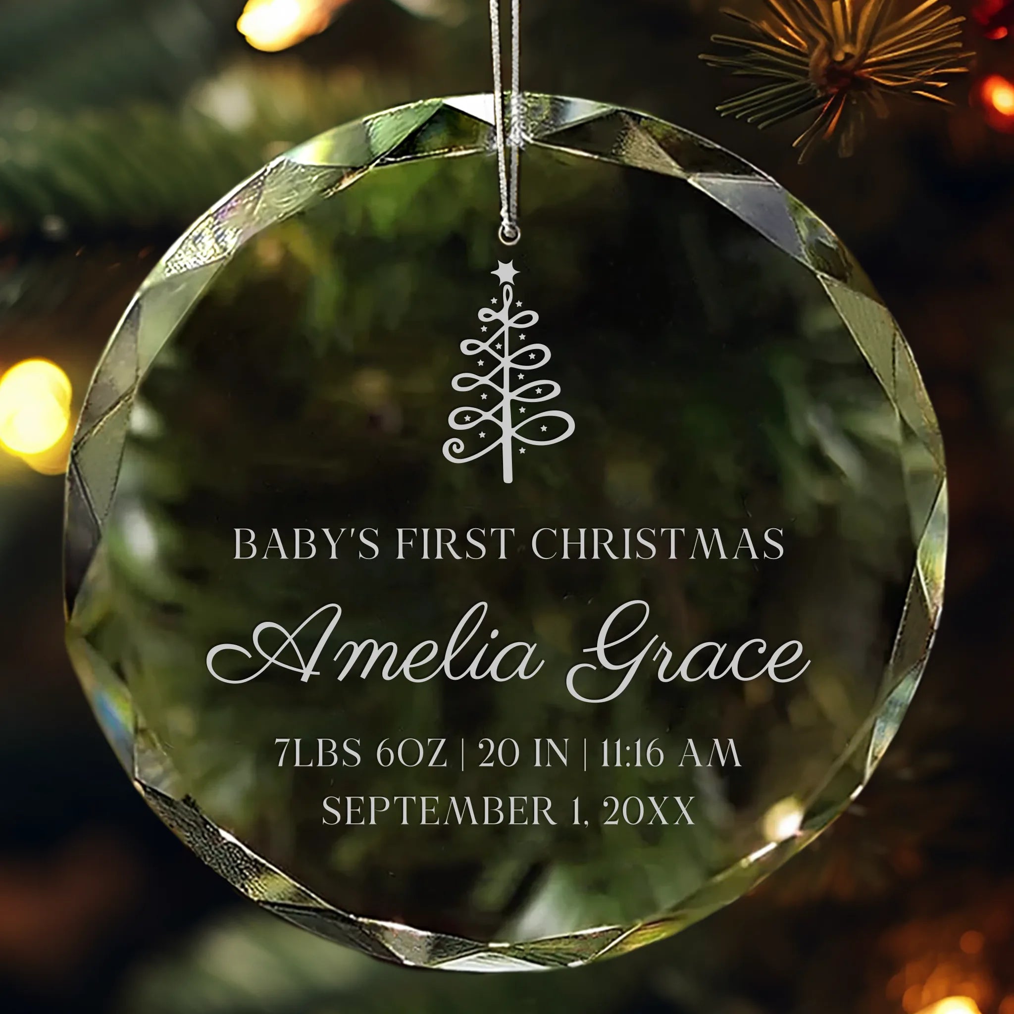 Personalized crystal ornament engraved with baby’s name, birth details, and Christmas tree design for Baby’s First Christmas.
