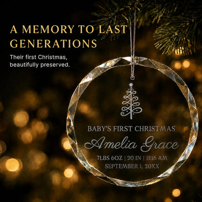 Personalized baby's first Christmas ornament in K9 optical glass hanging on a lit tree, engraved with a Christmas tree, baby's name and birth stats