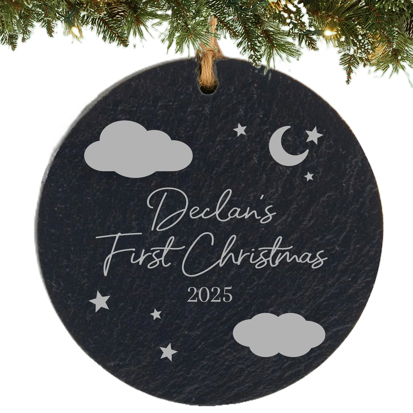 Slate ornament engraved with clouds, stars, moon, baby’s name, and “First Christmas” with the year.