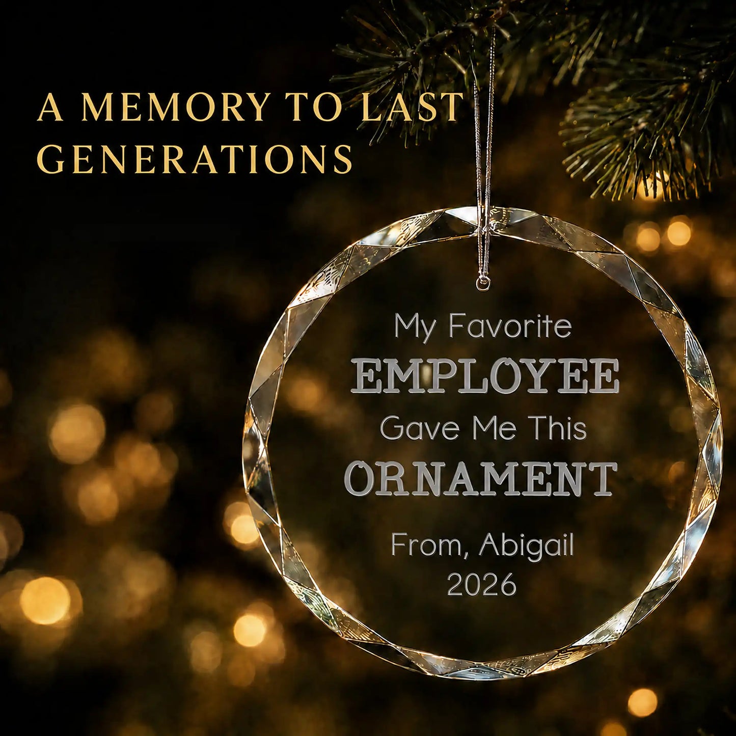 Personalized My Favorite Employee glass Christmas ornament in K9 optical glass hanging on a lit tree, engraved with the giver's name and year