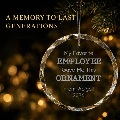 Personalized My Favorite Employee glass Christmas ornament in K9 optical glass hanging on a lit tree, engraved with the giver's name and year