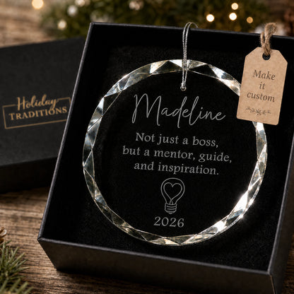 Mentor and inspiration boss personalized glass ornament with a heart lightbulb, laser engraved with the boss's name and year, shown in its black gift box
