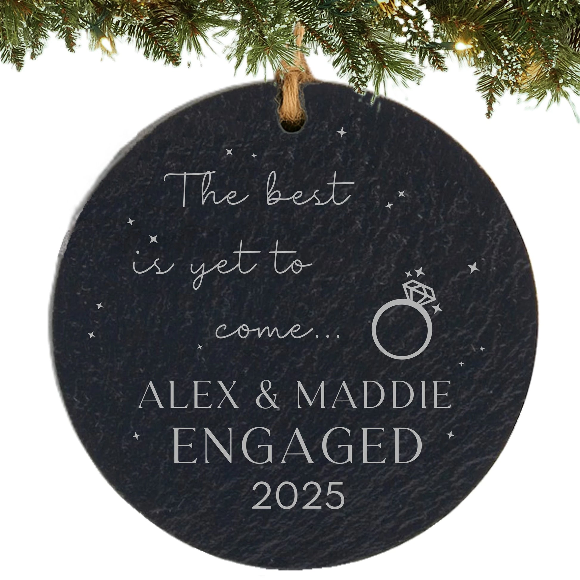 Round slate ornament engraved with “The best is yet to come,” engagement ring graphic, couple’s names, and year.