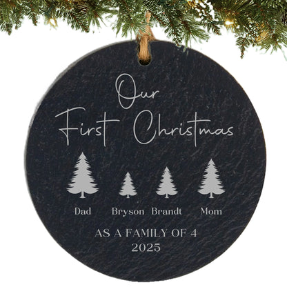Slate ornament engraved with “Our First Christmas,” four tree icons with names, and “As a Family of 4” with the year.