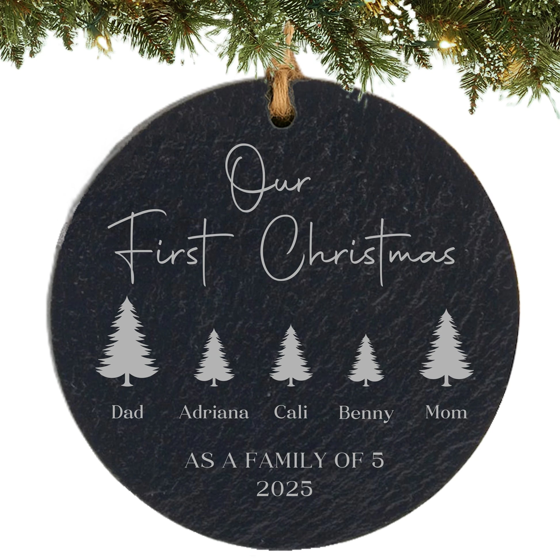 Slate ornament engraved with “Our First Christmas,” five tree icons with names, and “As a Family of 5” with the year.