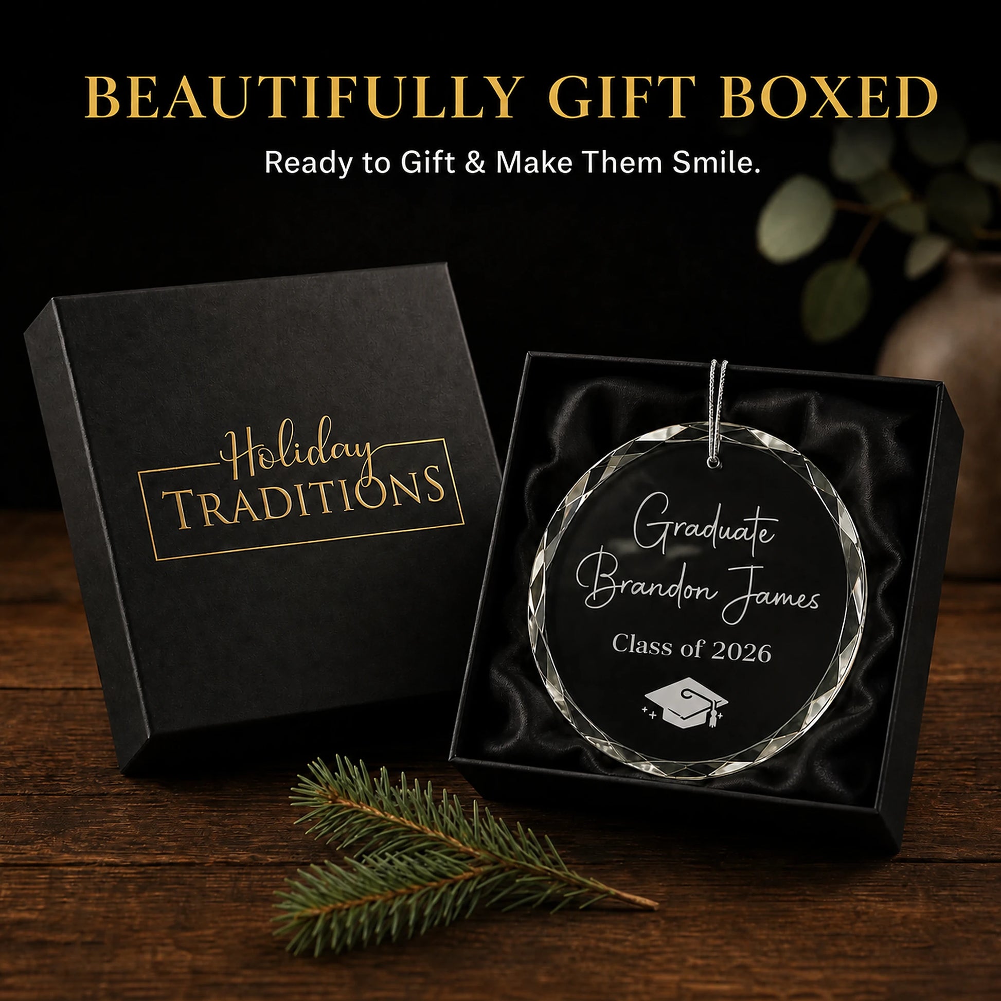 Graduate personalized glass ornament arrives in a black Holiday Traditions gift box, ready to give