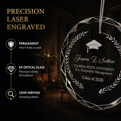 Close up of precision laser engraving on the laurel wreath custom graduation glass ornament, permanent lettering that will not fade or peel