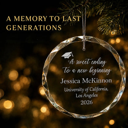 Personalized graduation Christmas ornament in K9 optical glass hanging on a lit tree, engraved with A sweet ending to a new beginning and the graduate's name, school and year
