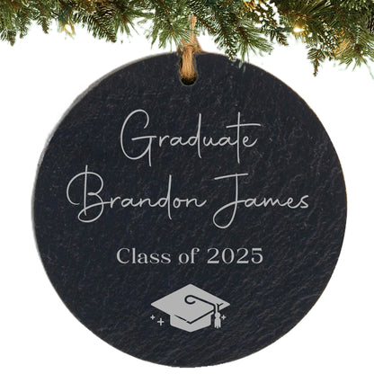 Slate ornament engraved with “Graduate,” student’s name, class year, and graduation cap icon.