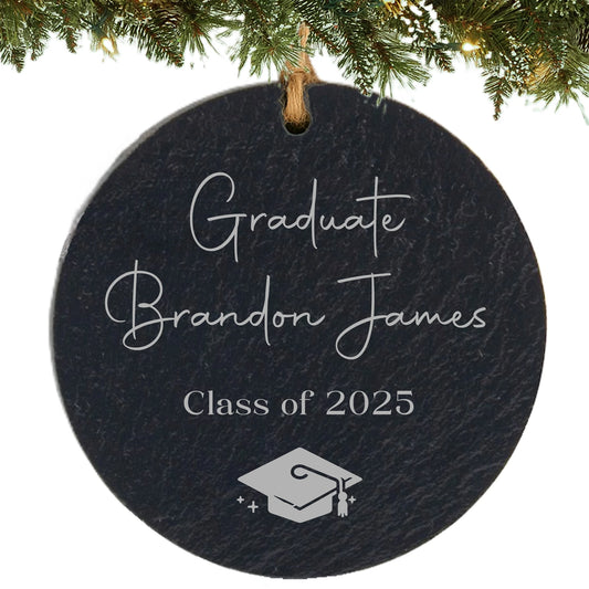 Slate ornament engraved with “Graduate,” student’s name, class year, and graduation cap icon.
