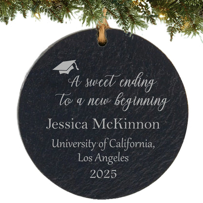 Slate ornament engraved with inspirational quote, graduation cap, graduate’s name, university, and class year.