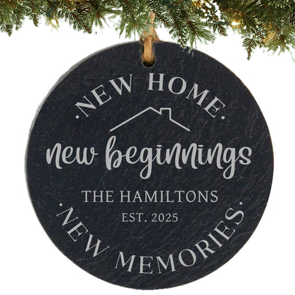 Slate ornament engraved with “New Home, New Beginnings, New Memories,” house outline, family name, and established year.