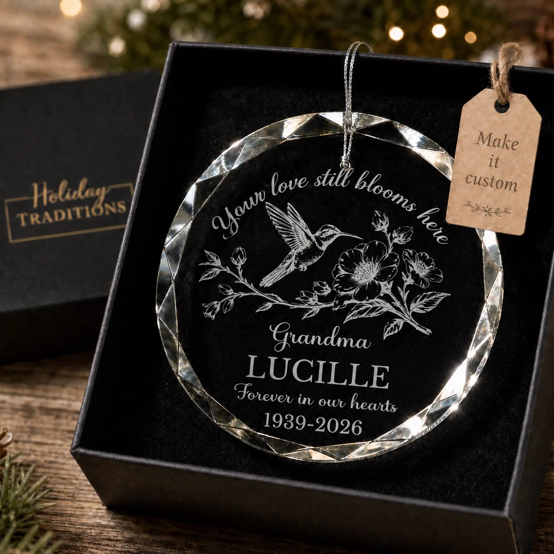 Personalized hummingbird memorial Christmas ornament in gift box - engraved glass reading 'Your love still blooms here' with custom name and memorial dates