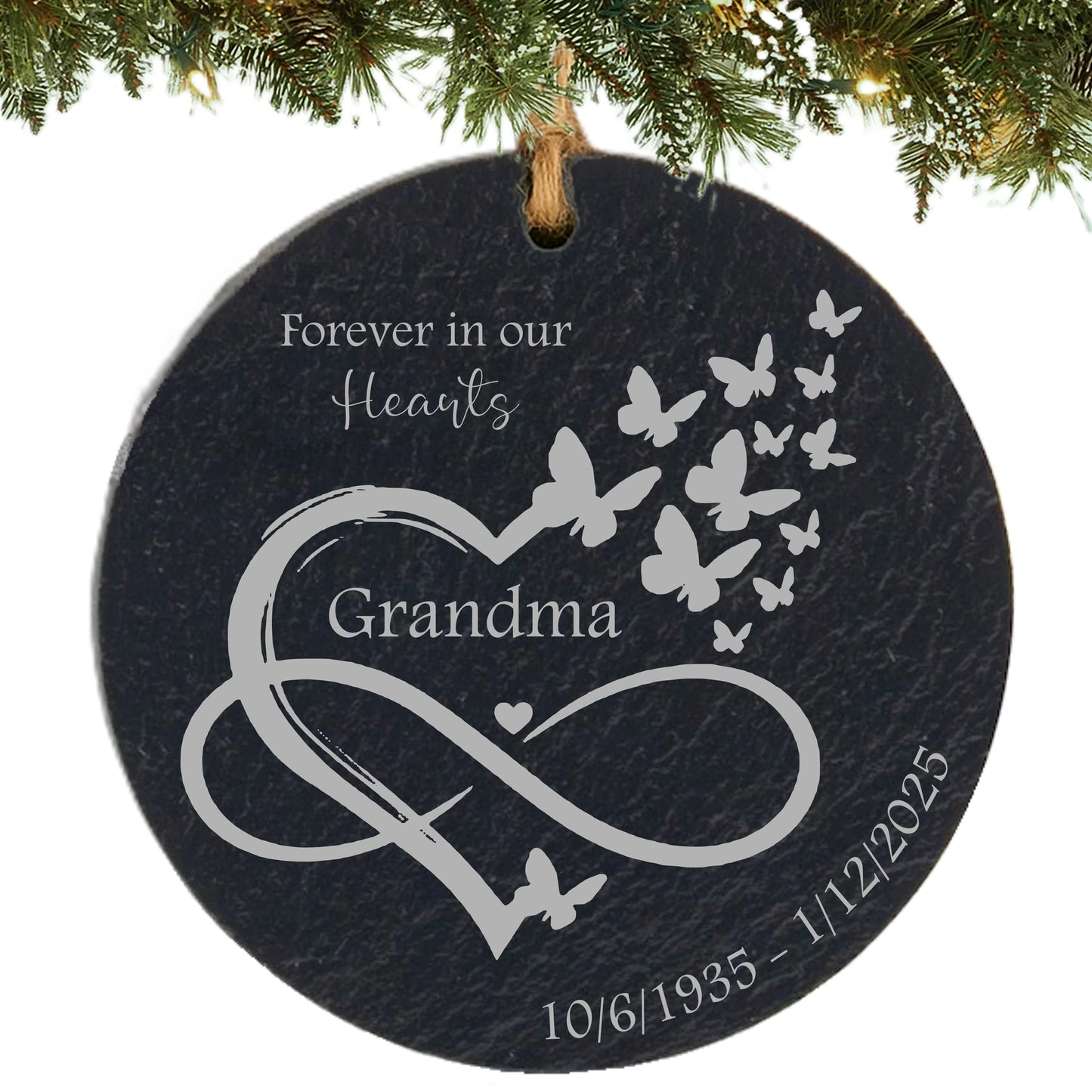 Slate ornament engraved with “Forever in Our Hearts,” an infinity heart with butterflies, name, and memorial dates.