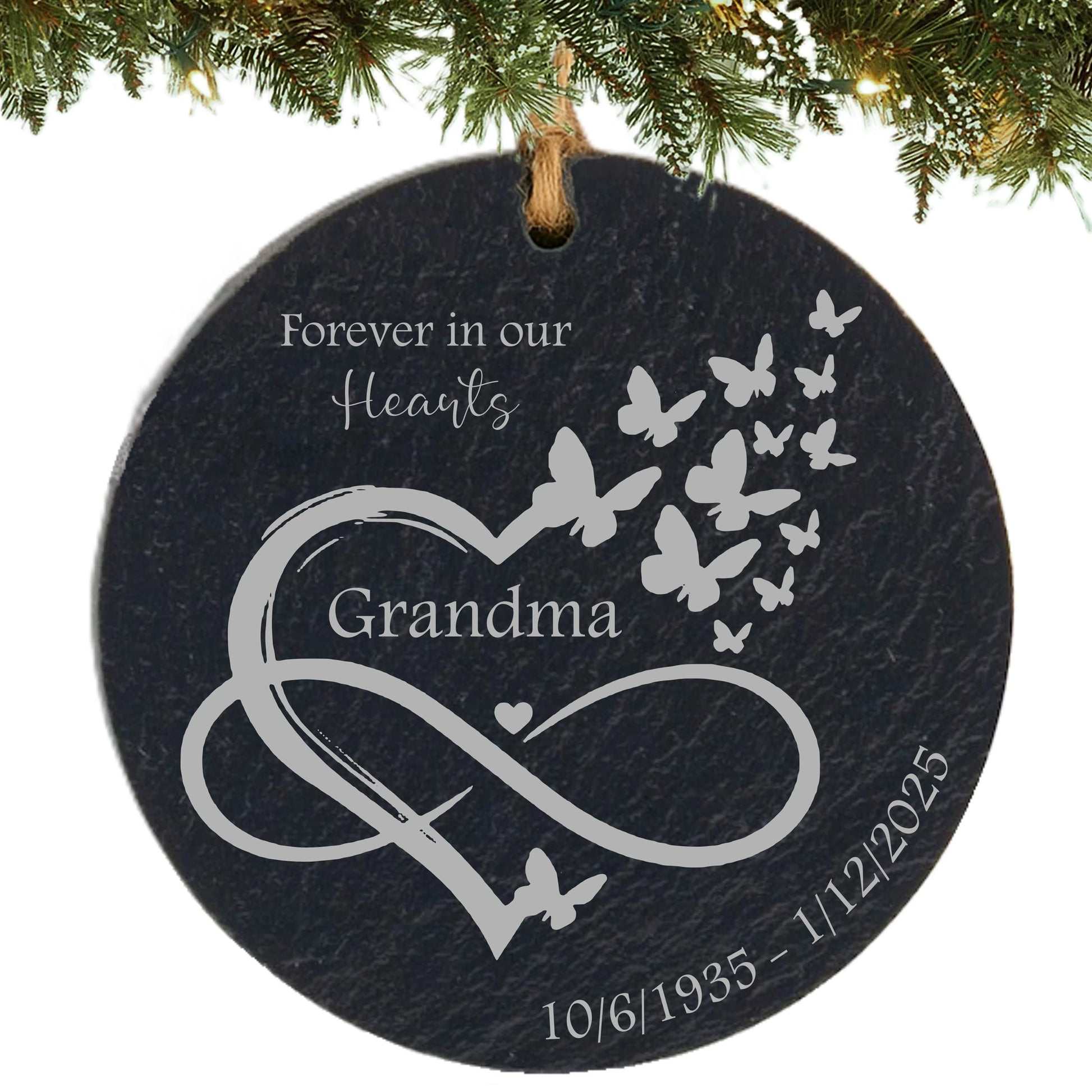Slate ornament engraved with “Forever in Our Hearts,” an infinity heart with butterflies, name, and memorial dates.