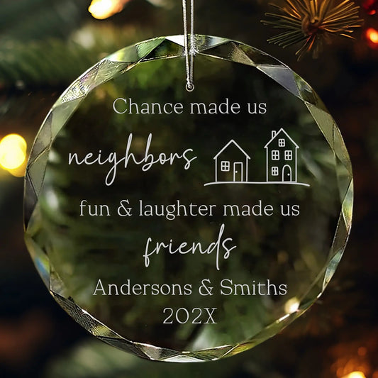 Crystal ornament engraved with houses, neighbor quote, family names, and year.