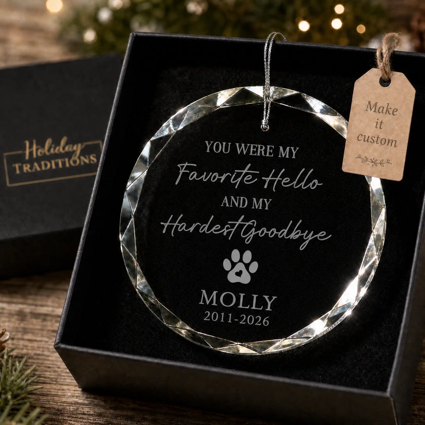 Favorite Hello Hardest Goodbye pet memorial personalized glass ornament with a paw print and heart, laser engraved with the pet's name and memorial dates, shown in its black gift box