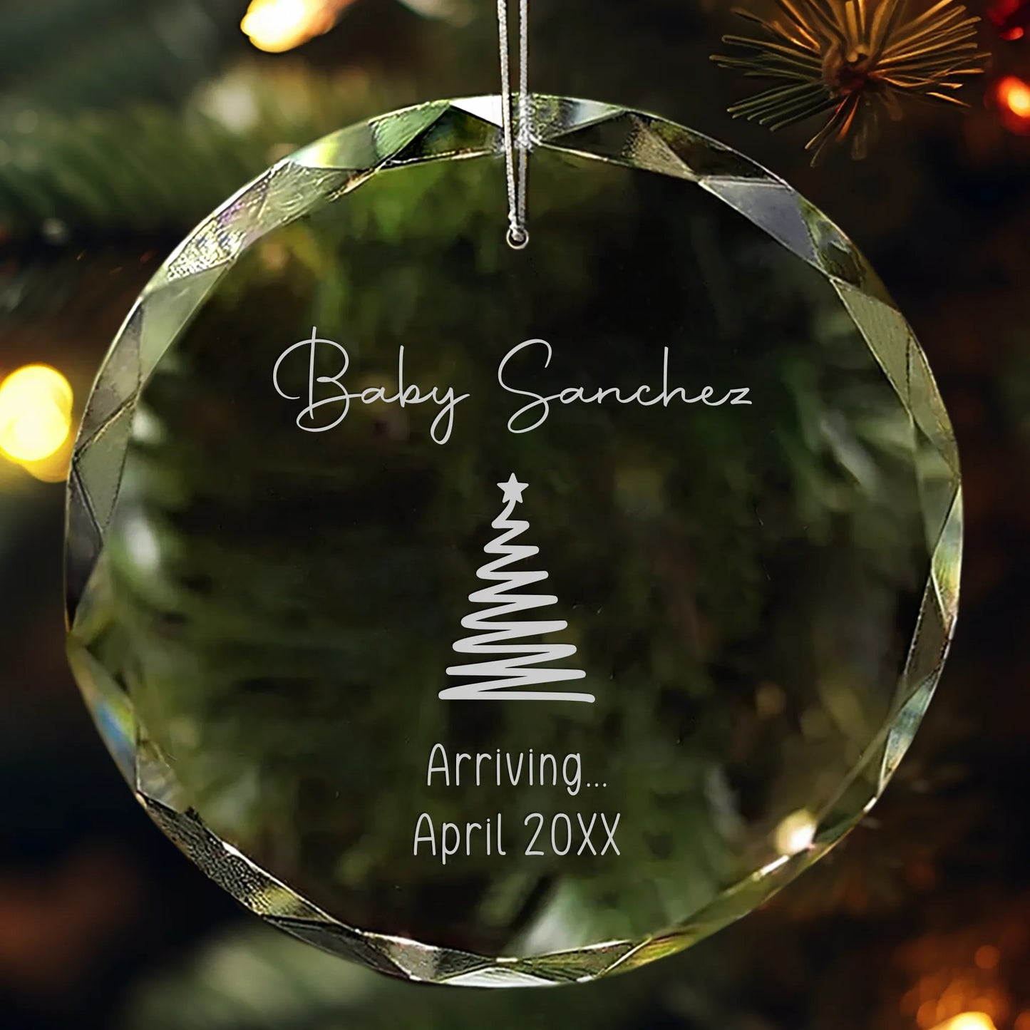 Personalized glass ornament engraved with “Baby [Name]” and due date featuring Christmas tree design.