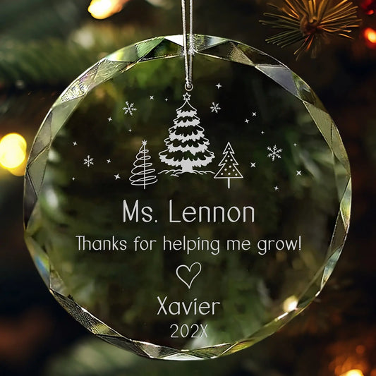 Crystal ornament engraved with trees, snowflakes, teacher’s name, thank-you message, child’s name, and year.