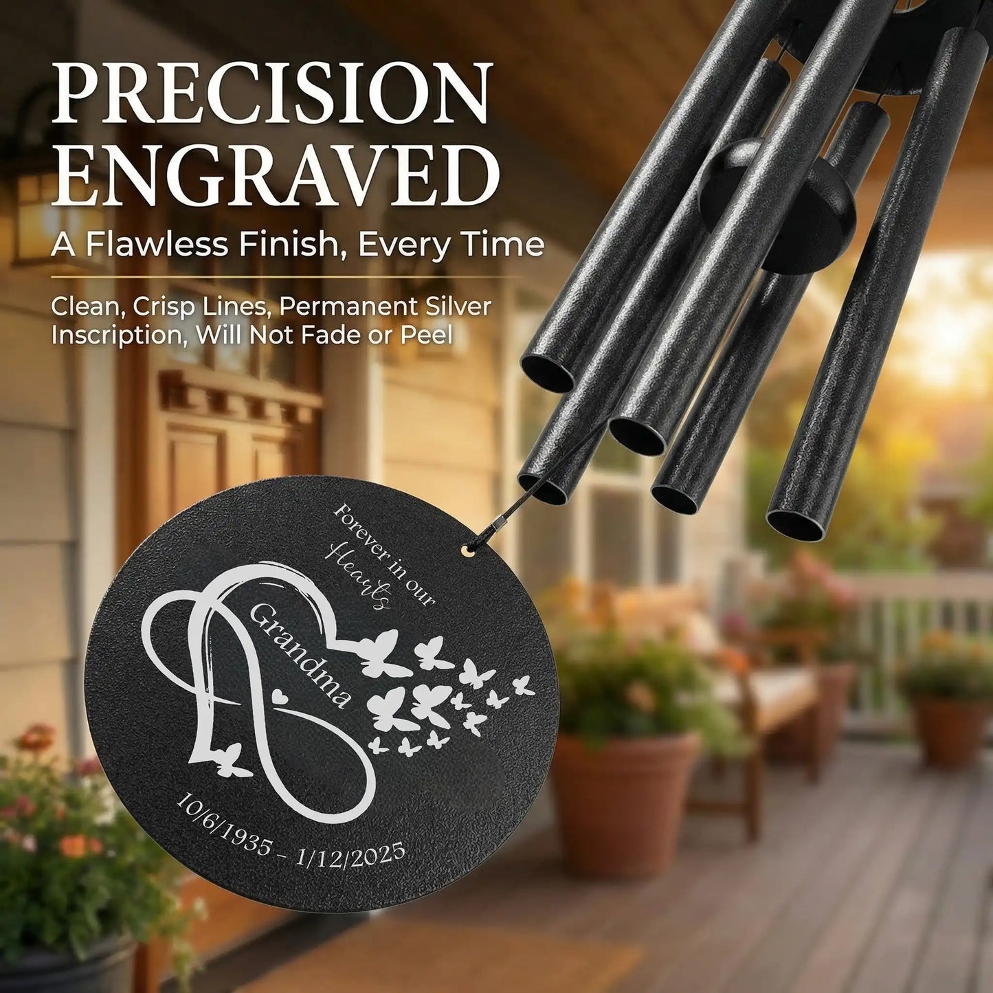 Personalized memorial wind chime with Forever in our hearts disc, laser engraved name and dates, black powder coated aluminum with a blurred background