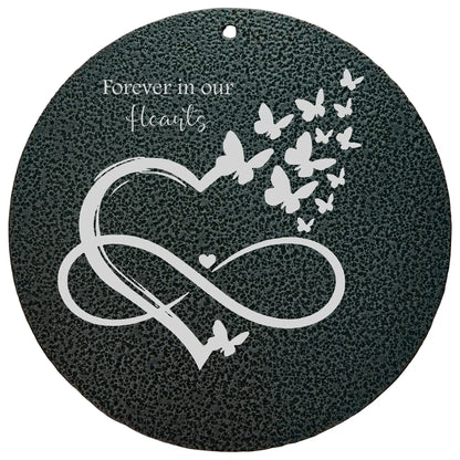 Memorial plaque for wind chimes with heart, infinity symbol, and butterflies on a dark background.